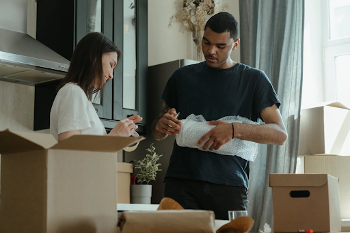 two people using bubblewrap